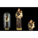 Religious Interest, A Figure of a Saint and Child, housed in a glass dome 16 inches in height.