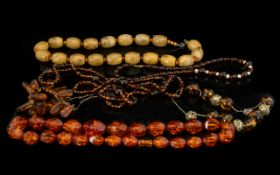 A Collection of Various Vintage Amber Beads, various sizes and weights (5) sets in total.