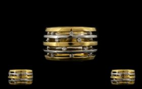 18ct Two Tone Gold Attractive Contemporary Design Diamond Set Band Ring.