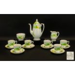 Hand Painted Coffee Set by Roslyn in white ground with delicate yellow and green floral design.