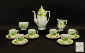 Hand Painted Coffee Set by Roslyn in white ground with delicate yellow and green floral design.