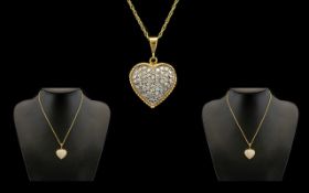 18ct Gold Heart Shaped Diamond Set Pendant Attached to a 18ct Gold Chain, The Whole Making a Very