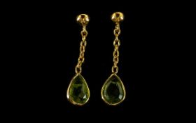 Peridot Pendant Earrings, two pear cut peridots, totalling 2.