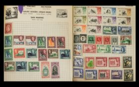 A Green Spring Back Stanley Gibbons Swiftsure Expanding Stamp Album with a large quantity of King