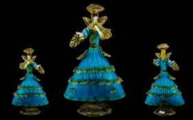 A Murano Glass Flamenco Dancer Figurine, in traditional dress and surmounted on a circular base.