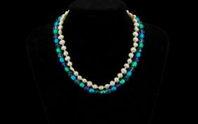 Freshwater Pearl Necklace, together with a blue beaded necklace.