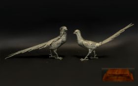A Pair Of Spelter Figures In The Form Of Oriental Pheasants Silver tone bird figures,