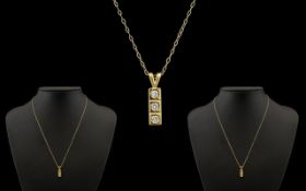9ct Yellow Gold Necklace and gem set three stone set pendant.