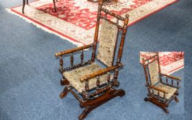 Child's Mahogany Spindle Rocking Chair with Victorian antique dark green studded upholstery.