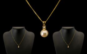 A 9ct Yellow Gold Pearl and Diamond Pendant Drop Necklace.