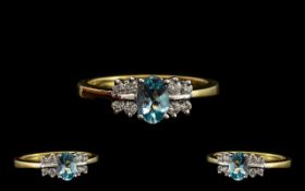 18ct Gold - Attractive Aquamarine and Diamond Set Dress Ring. Full Hallmark for 750 - 18ct.