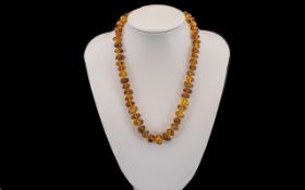 Amber Coloured Beads, Graduated amber coloured beads with tiny bead spacers.