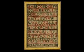 Sampler of Alphabet framed and under glass. Signed at the bottom 'Arabella Brown 1817'.