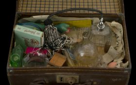 A Small Vintage Suitcase containing various assorted collectables.