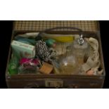 A Small Vintage Suitcase containing various assorted collectables.