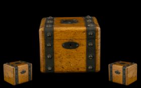 Oak Tea Caddy with metal banding with studs, shield top. Early 20th century. See images.