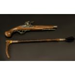 Riding Crop Along With a Flintlock Replica Gun. Approx size of the Riding Crop Is 18.