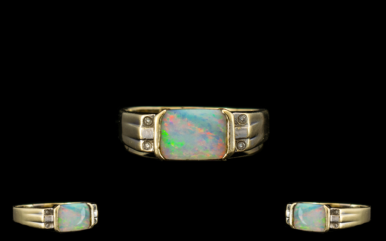 18ct Gold Attractive Opal and Diamond Set Dress Ring. The Rectangular Shaped Opal of Good Colours.