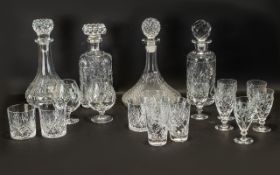 A Cut Glass Drinking Set comprising of four good quality cut glass decanters, two sherry glasses,