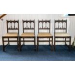 A Set Of Four Jacobean Style Dining Chairs carved and spindle back with drop-in seat, square cross-