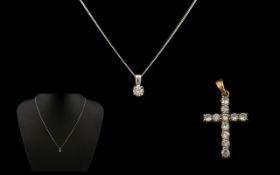 A 9ct White Gold Diamond Pendant Drop Necklace. With original H Samuel presentation box.