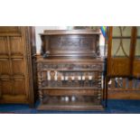 A Carved Oak Continental Buffet Of large proportion with barley twist supports, two shelves and