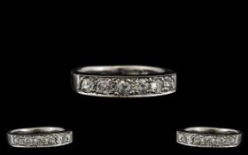 18ct White Gold - Quality and Pleasing Seven Stone Diamond Ring. Fully Hallmarked for 18ct - 750.