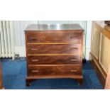 Traditional Victorian Chest of Drawers of plain form, four equal sized drawers with wooden handles.