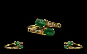 18ct Gold Superb Quality and Attractive Emerald and Diamond Dress Ring of contemporary design. The