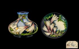 Moorcroft - Modern Tube lined Squat Shaped Vase ' lilies ' Design on Pale Blue Ground. Date 2004 &