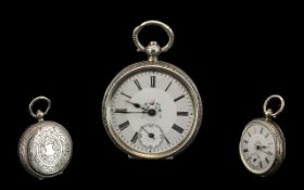 A Continental Silver Fob Watch, white enamel dial, with Roman Numerals and subsidiary seconds. Key