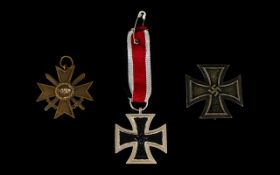 Replica German Iron Cross with pin. Together with two others.