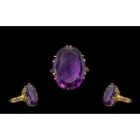 Ladies 9ct Gold Large Faceted Single Stone Amethyst Set Dress Ring from the 1960's. The faceted