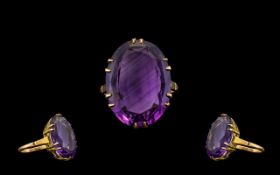 Ladies 9ct Gold Large Faceted Single Stone Amethyst Set Dress Ring from the 1960's. The faceted