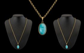 14ct Gold Turquoise Stone Set Oval Pendant with Attached 9ct Gold Belcher Chain. Pendant Marked