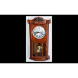 20th Century Box Wall Clock with silvered dial, Roman numerals and glazed front.