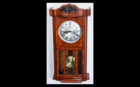 20th Century Box Wall Clock with silvered dial, Roman numerals and glazed front.