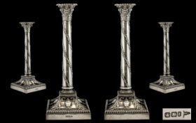 Pair Of Late Victorian Sterling Silver Table Candlesticks, in a Neoclassical style having square