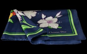 Christian Dior Silk Scarf in dark blue background with multi-colour floral design.