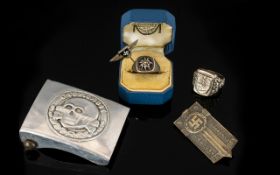 A Small Mixed Lot Of German Nazi Replicas, To Include Two Rings, an enamelled badge,