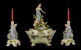 Saxony Figural Centrepiece Garniture, comprising a female figure, accompanied by a putto, standing