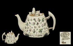 Portmeirion Tea Pot 'Botanic Garden' with decorative lid of table set for tea. In good condition.