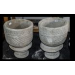 Two Mayan Urns - circular planter decorated with Aztec design on circular base.