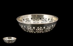 A Silver Pierced Bon Bon dish of plain form with a beaded edge. Hallmarked for Birmingham U -