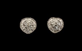 Diamond Cluster Earrings, .5ct; each having a raised centre of round cut diamonds framed by two,
