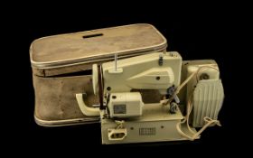 A Micro E Lite Minature Sewing Machine In Case With Foot Pedal -Made By Saitana Sewing Machine