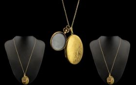 An Early 20thC Rolled Gold Picture Locket of circular form. Glazed front and back. Together with a