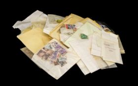 Large Bag of Mixed Stamps - sorted into packets.