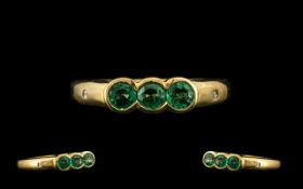 9ct Gold Dress Ring set with three round cut emeralds fully hallmarked. Ring size N.