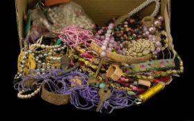 A Box Containing a Quantity of Costume Jewellery to include mostly assorted beads, various vintage